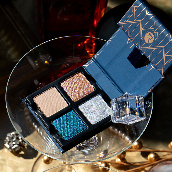 The Petits Fours Lapis pallet open in a martini glass showing its beautiful shimmering colors and showing how classy and elegant the colors are too.