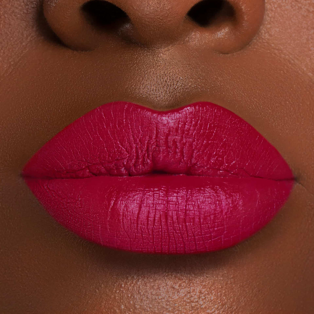 This is a dark skin tone lip swatch of the Merlot Liquid Matte Lip.