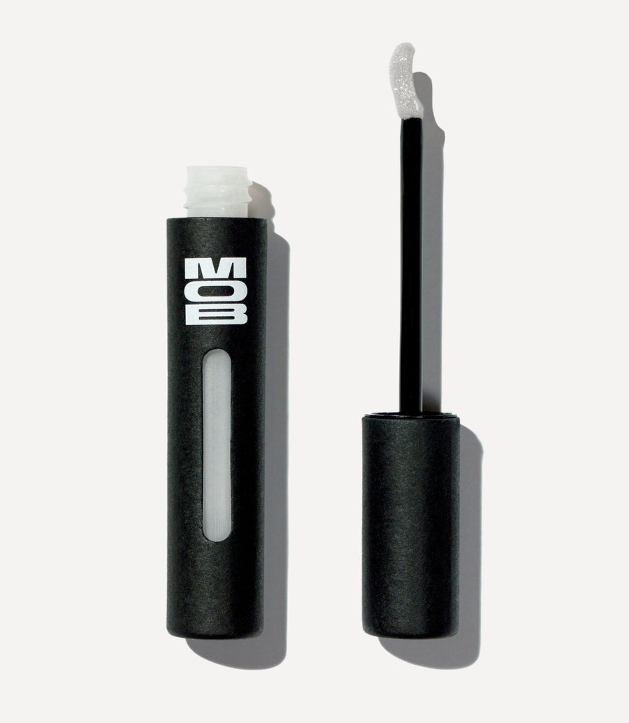 Black eyelash curler with 'MOB' branding on a white background