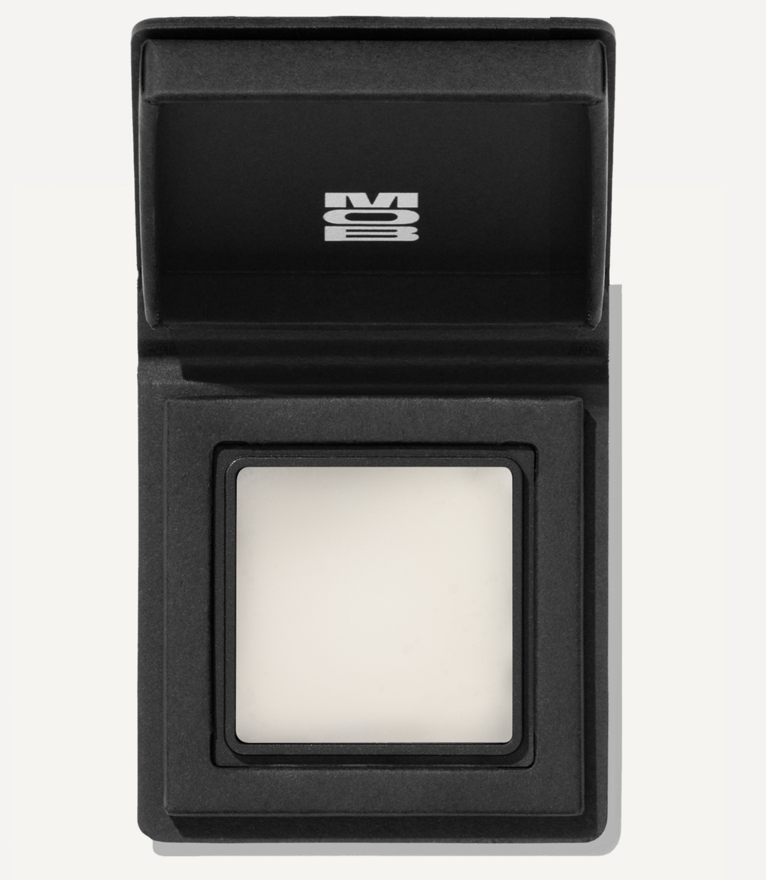 Black electronic device with a square component on a white background