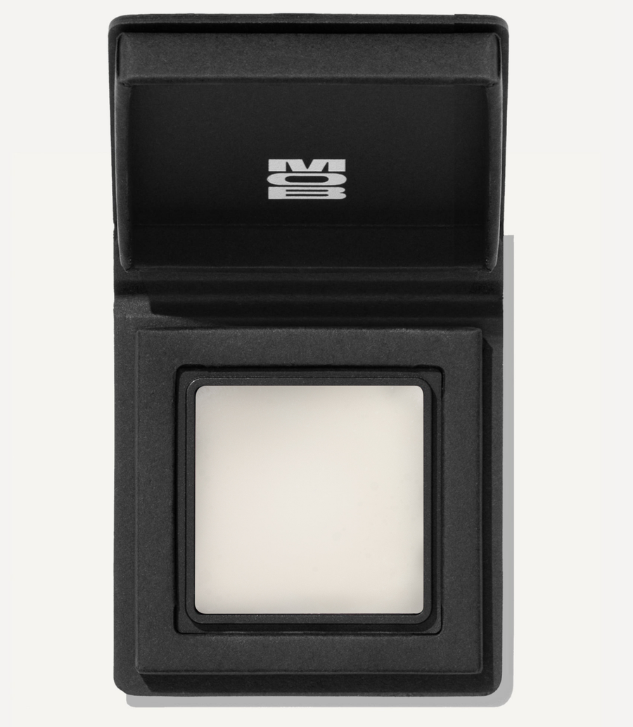 Black electronic device with a square component on a white background