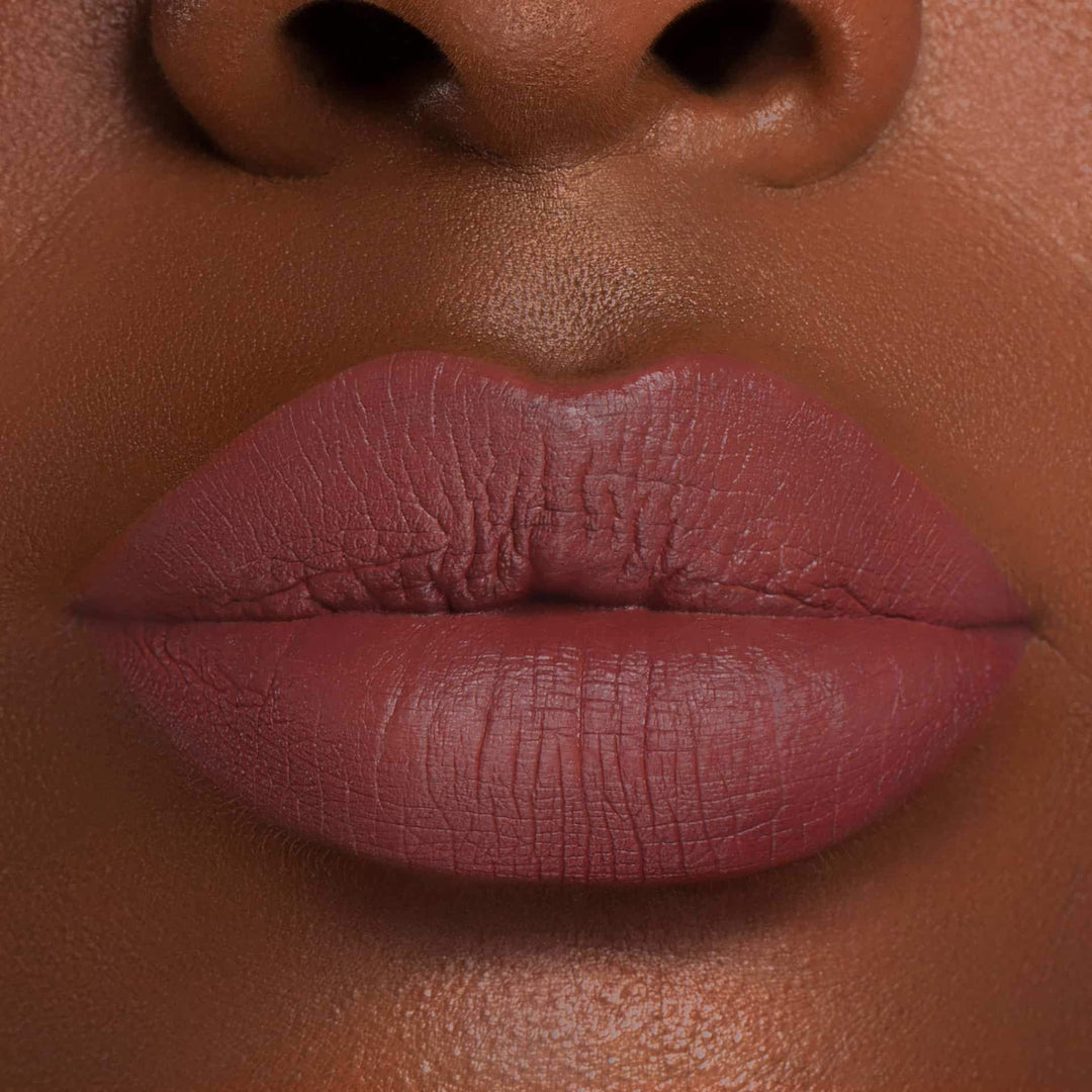 This is a dark skin tone lip swatch of the Mondaze Liquid Matte Lip.