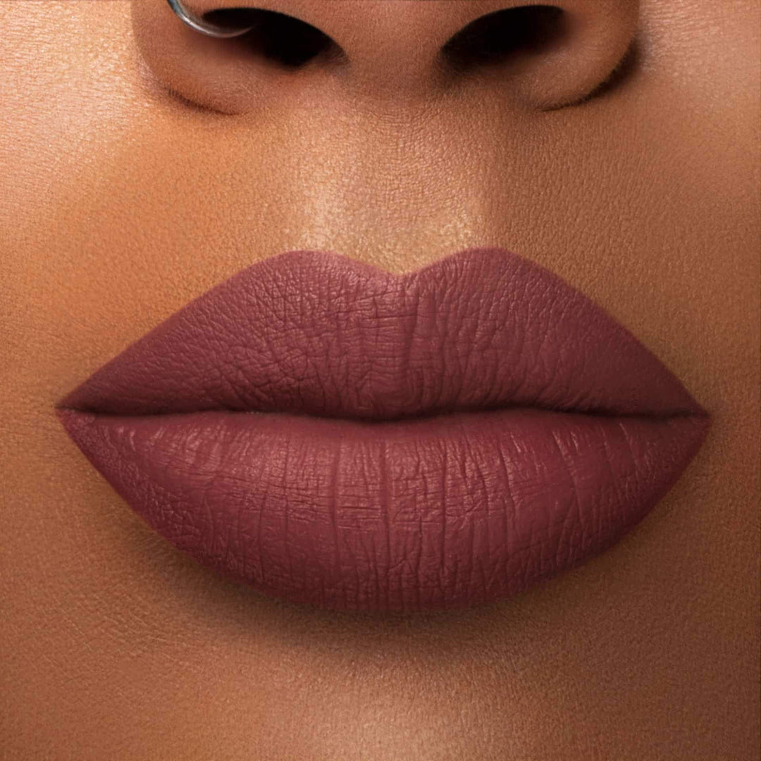 This is a medium skin tone lip swatch of the Mondaze Liquid Matte Lip.