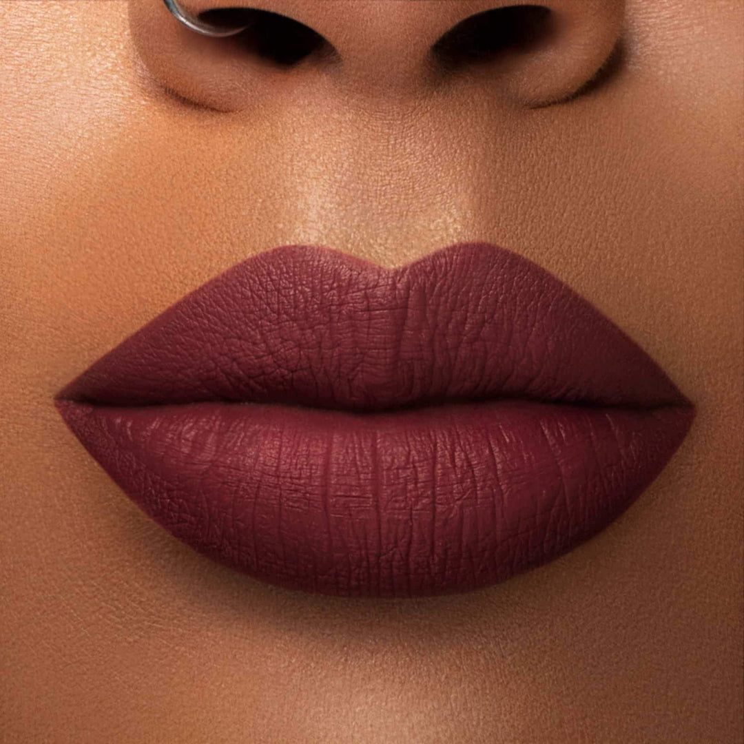 This is a medium skin tone lip swatch of the Mood Liquid Matte Lip.