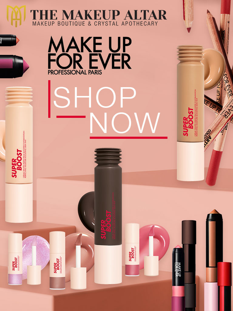 Makeup products with 'Make Up For Ever' branding on a pink background