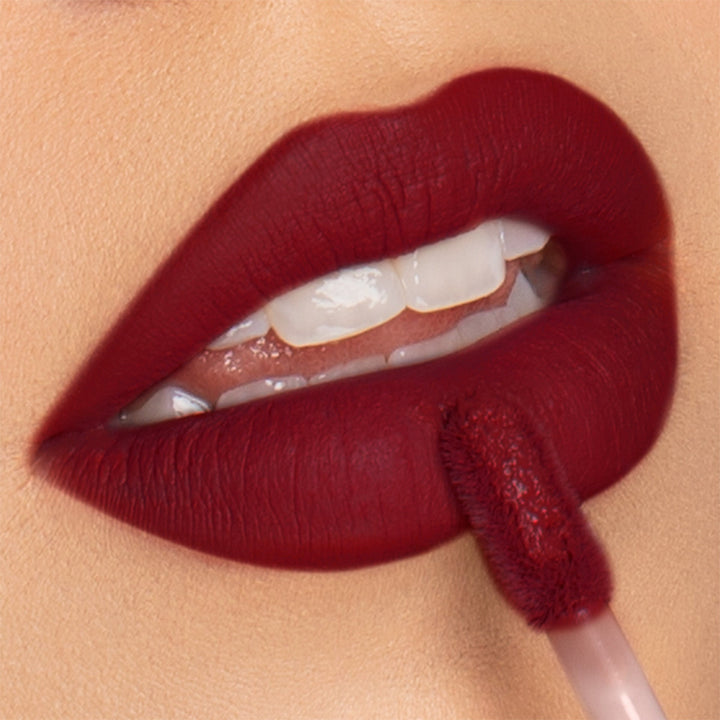 This is the Out of office Velvet Mousse Lipstick which is a deep red that feels like a luxurious velvet mousse. 