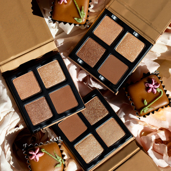A pretty picture of the Petits Fours Praline pallet open with chocolates in the background 