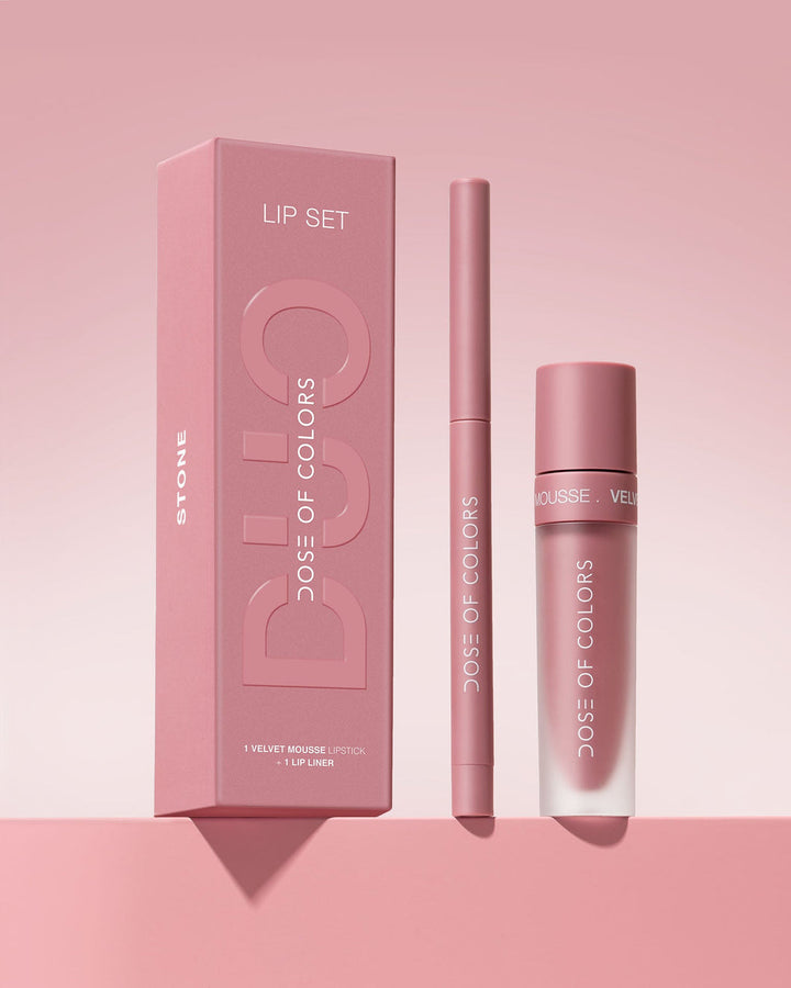 The Stone Velvet Mousse Lip Duo Set showing the beautiful pink box with the pink liner and lip color as well. The wording also in pink and white describing the brand. 