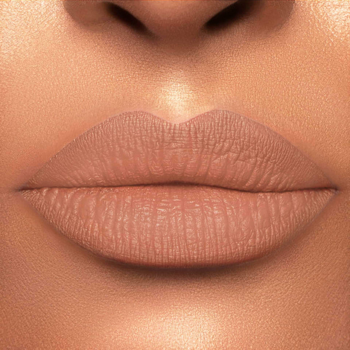 This is a light skin tone lip swatch of the Supernatural Liquid Matte Lip.