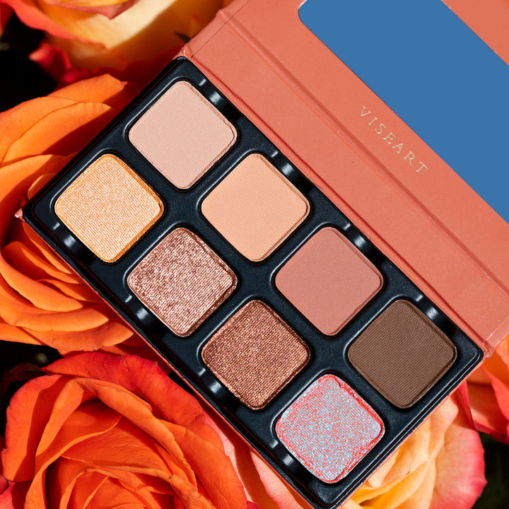 Solstice pallet behind a background of orange roses to see the colors shine differently behind a different background. 