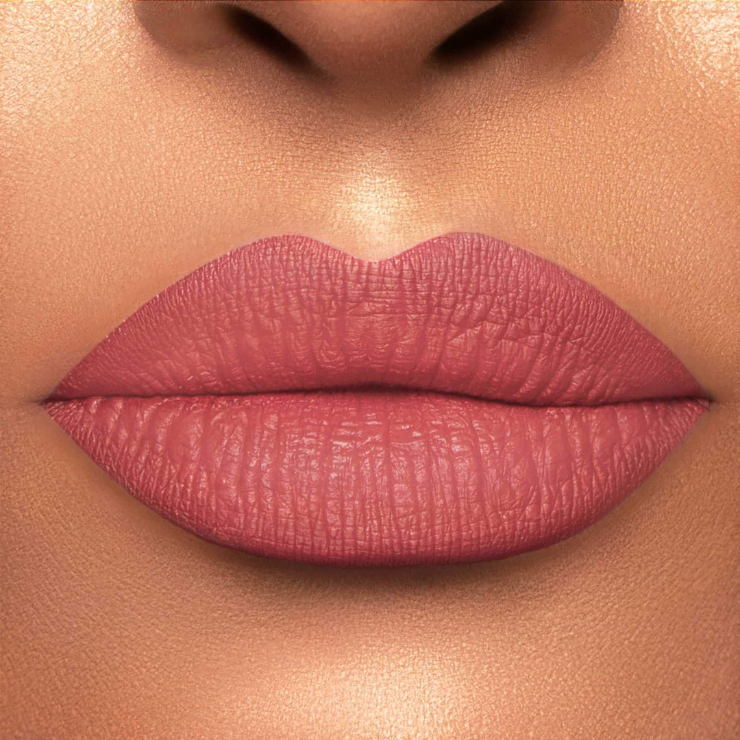 This is a light skin tone lip swatch of the Warm & Fuzzy Liquid Matte Lip.