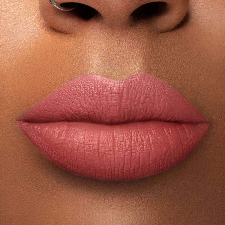  This is a medium skin tone lip swatch of the Warm & Fuzzy Liquid Matte Lip.