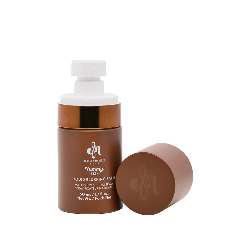 Brown cosmetic bottle with white cap on a white background