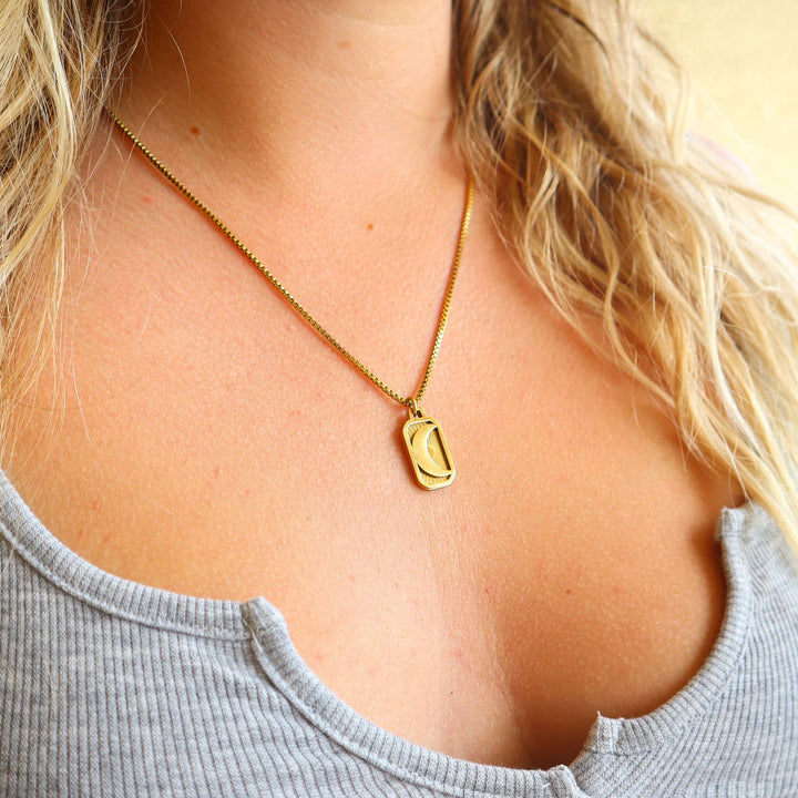 Crescent Moon Necklace alone on a model