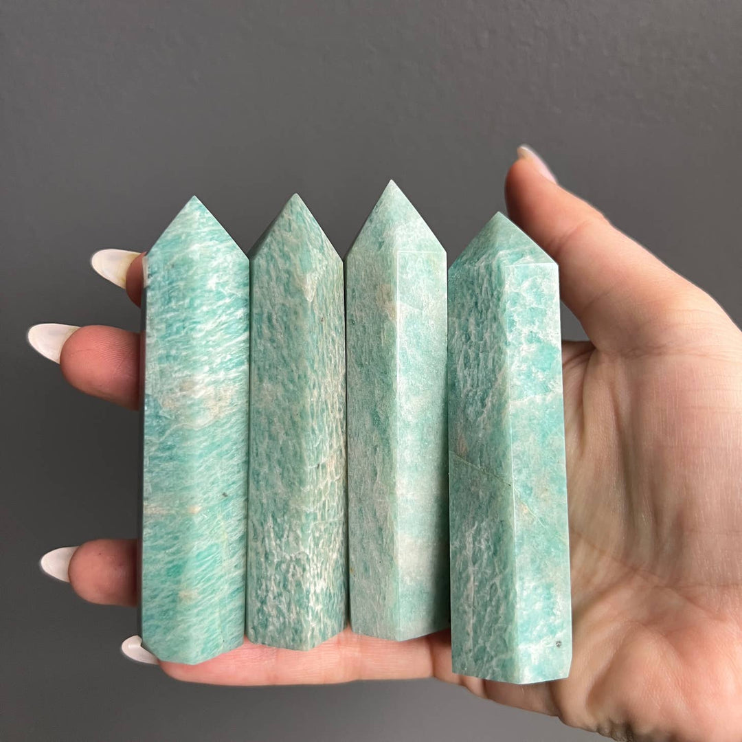 This is multiple Amazonite crystal towers that are a beautiful blue-ish green.