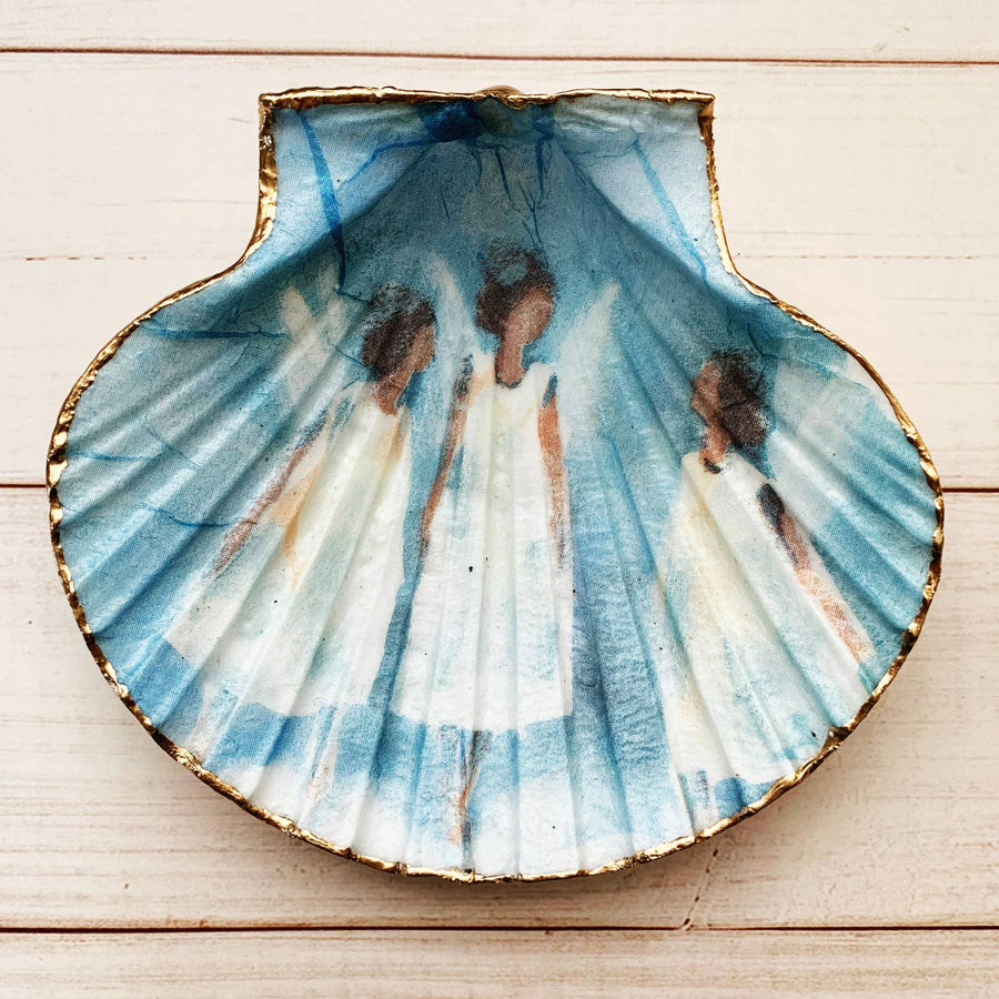 Hand painted shell with a blue background and white angels. 
