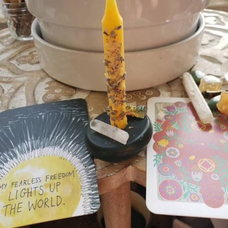 Her yellow candle on an altar set up