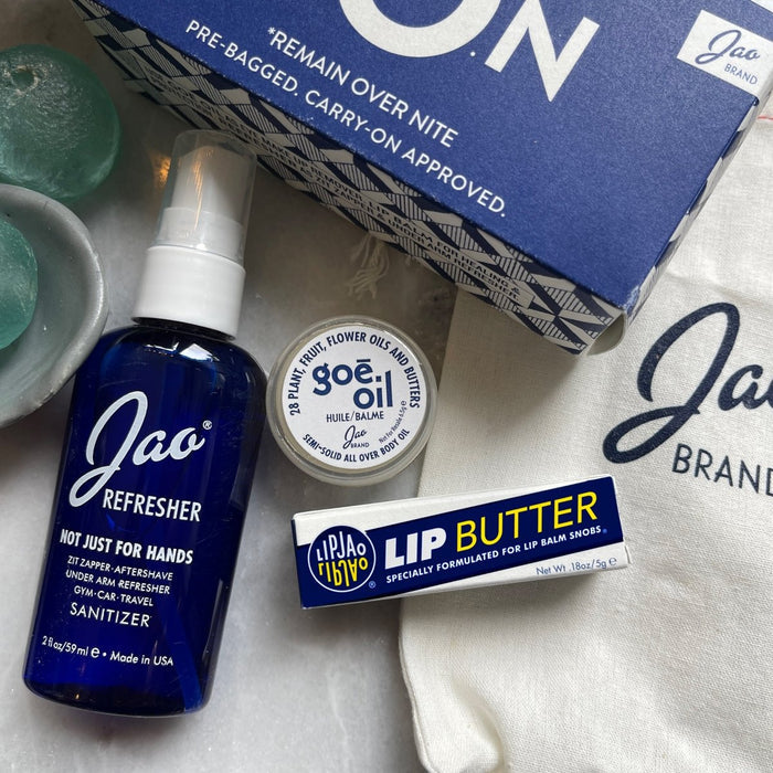 Jao Brand products including a bottle, jar, and lip balm on a white surface with a branded bag.