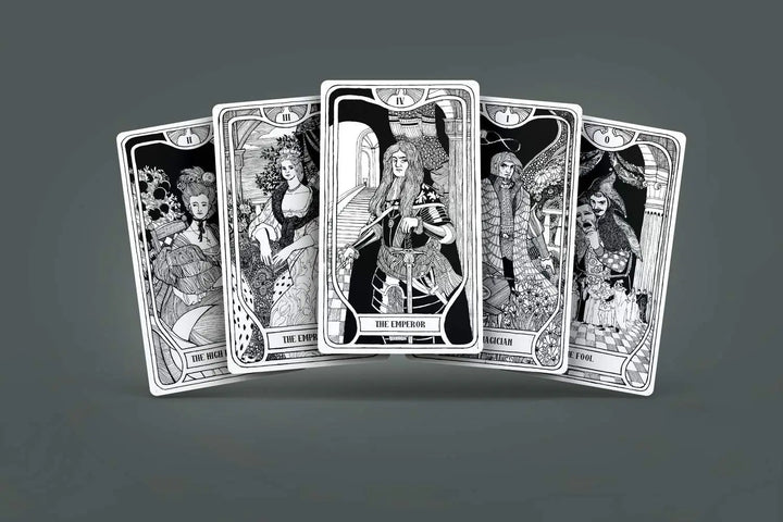 This is 5 cards included in the deck one which might be recognizable from the cover of the tarot deck. They are intricately designed period pieces in black and white.