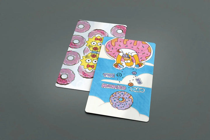 You have homers love of doughnuts on all the backs of the cards as well as a few on the cards themselves. No matter the side it is so silly and fun.