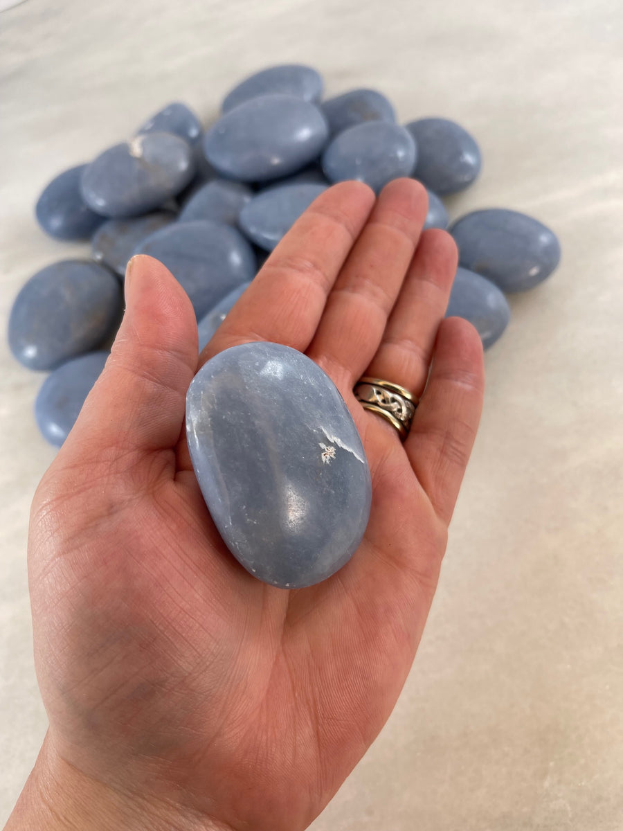 Holding an Angelite Palm Stone