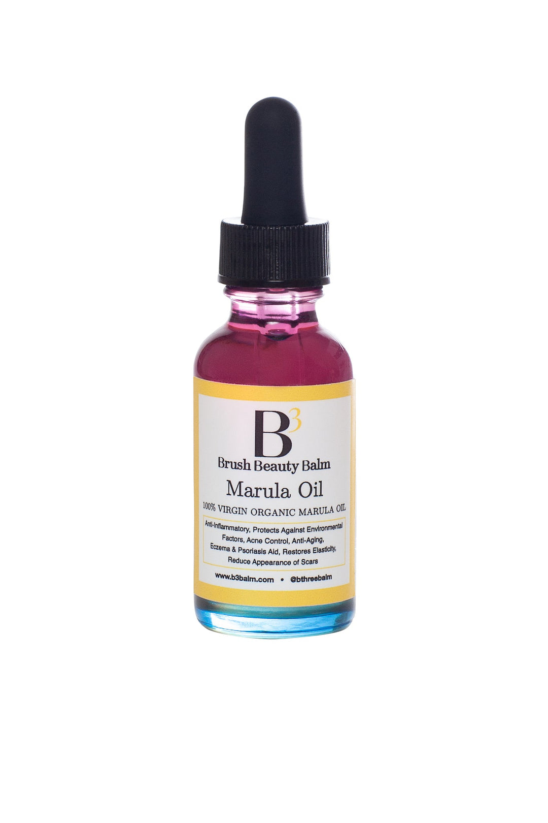 The Marula Facial Oil pink and blue glass bottle with white and yellow label that includes what it is used for