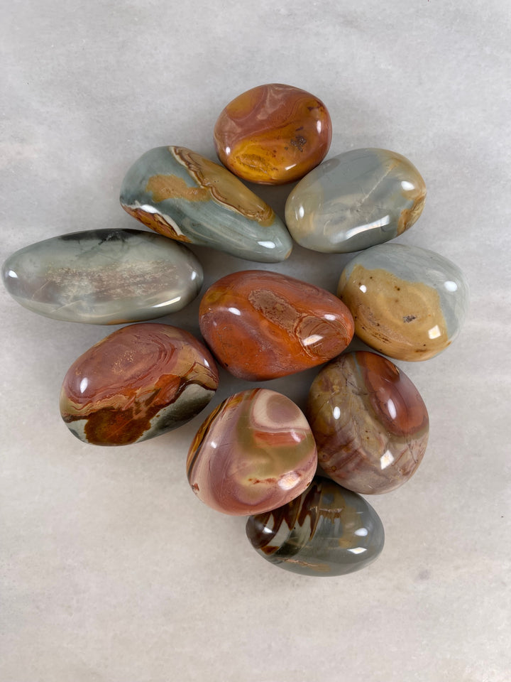 a group of Large Polychrome/Desert Jasper Palm stones