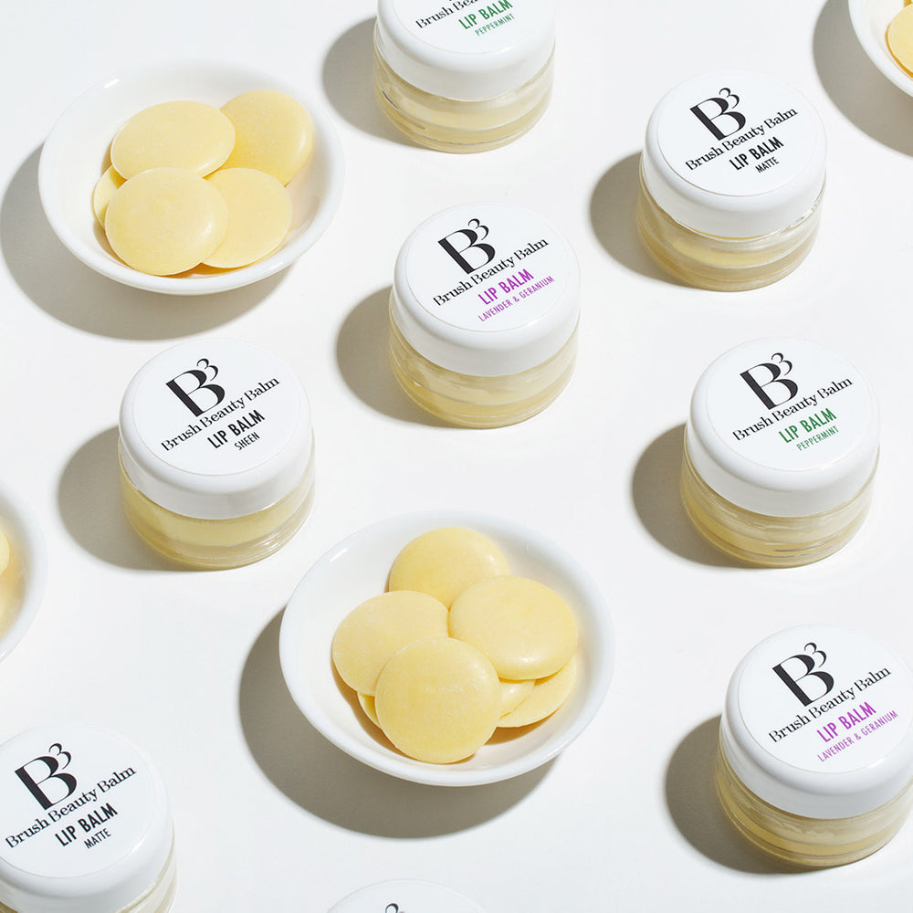 Each of the different B3 Lip Balms with the balm in the bowls and the faces of each Lip balm